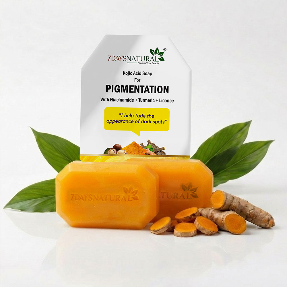 Two orange-yellow bars of 7 Days Natural Pigmentation soap displayed in front of their white packaging box, styled with fresh green leaves, turmeric root, and turmeric slices on a clean white background.