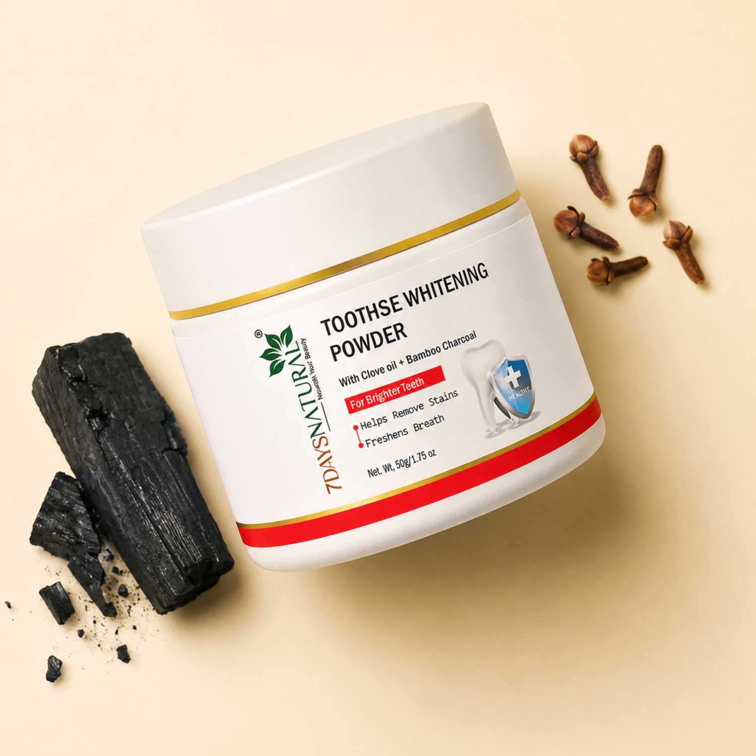 Tooth whitening powder container with charcoal and clove oil on a beige background