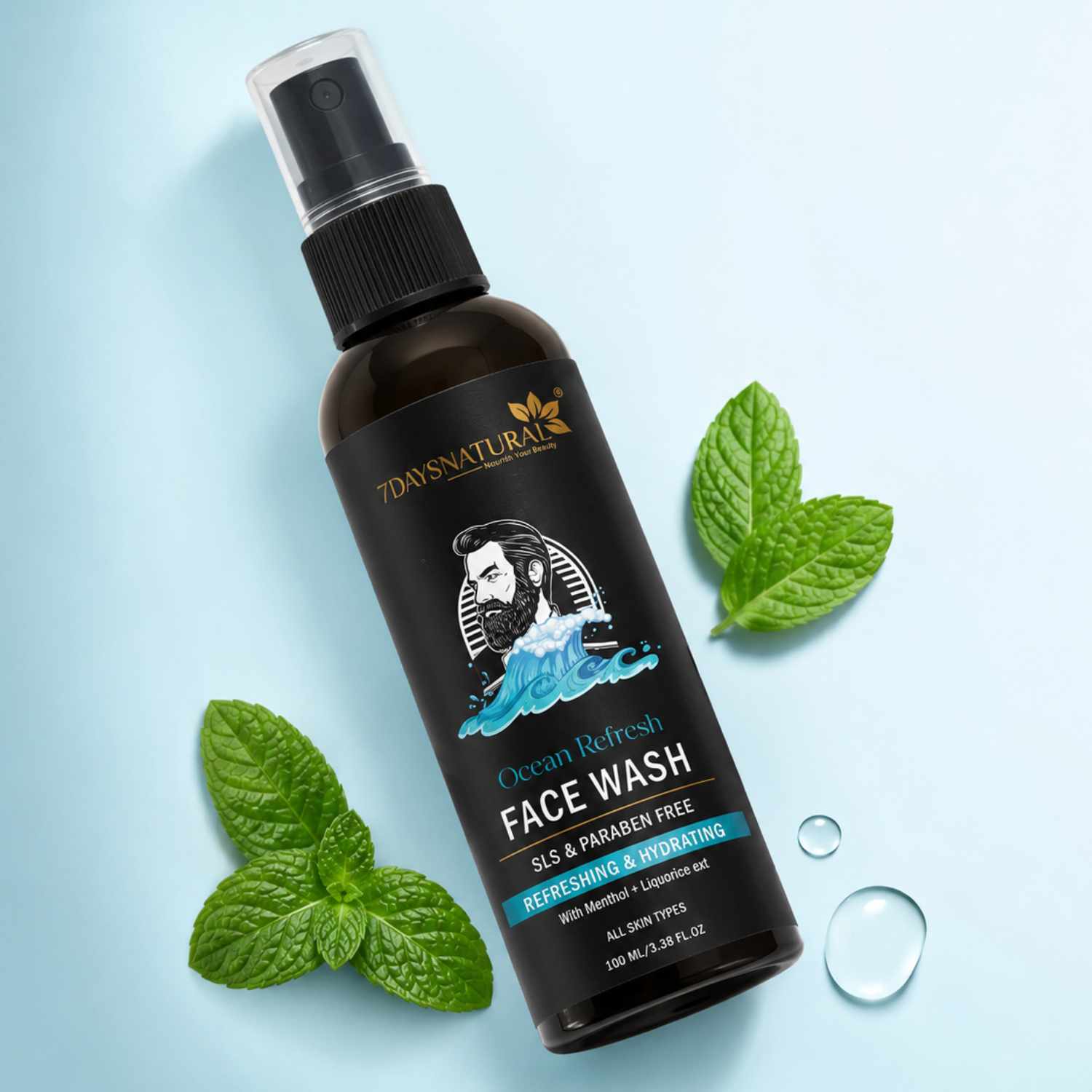 Bottle of 70s Natura Ocean Refresh Face Wash with mint leaves on a light blue background