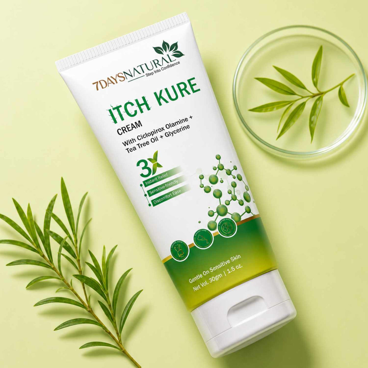 Tube of 7 Days Natural Itch Kure Cream with green leaves on a light yellow background