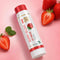 Berry Blush lip balm with strawberries on a pink background