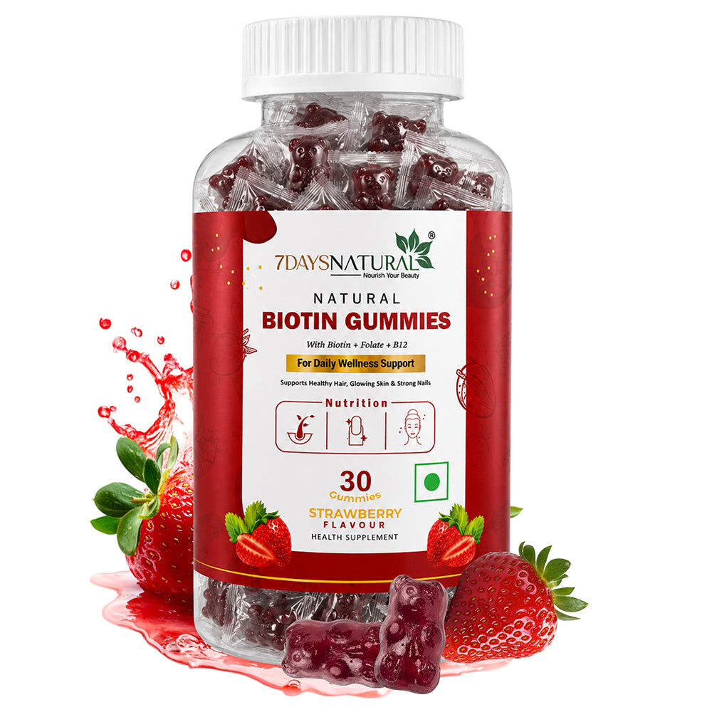 A bottle of 7DaysNatural Biotin Gummies, strawberry flavor, with several gummies and fresh strawberries arranged around the base on a white background.